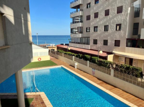 Apartment on the beach with parking and pool